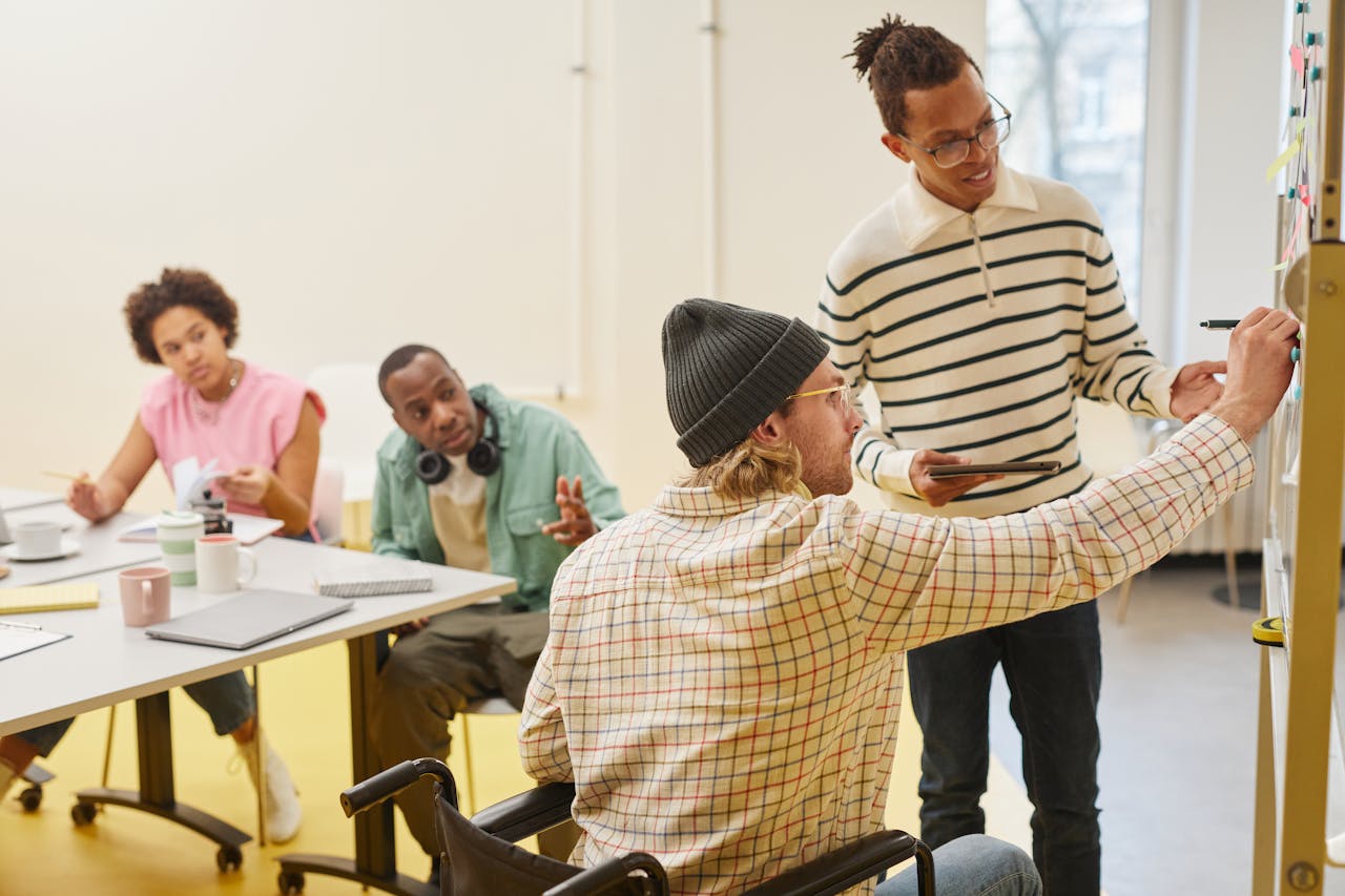 services-03 A diverse team collaborating in a modern office setting with a focus on planning and teamwork.