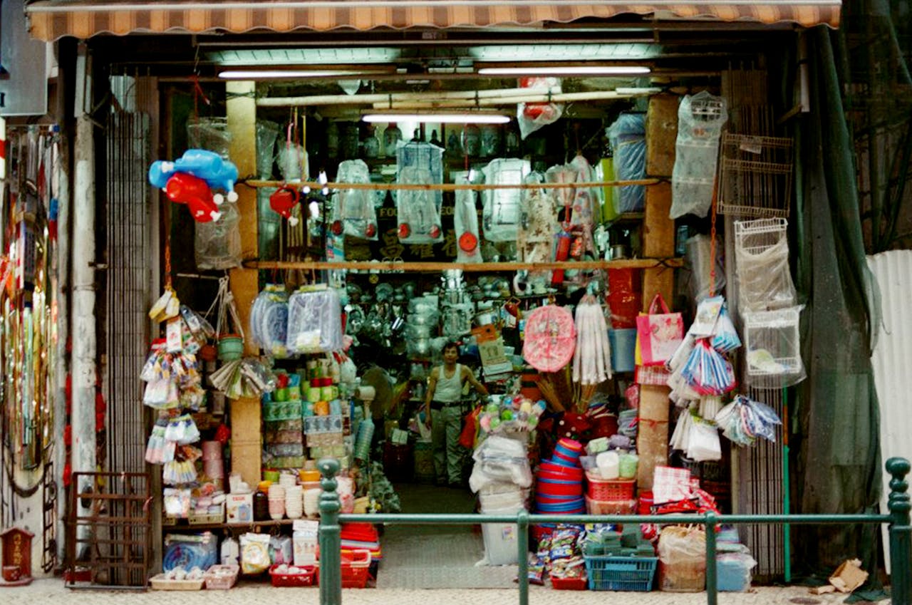 about-us A vibrant market stall in Macau selling various goods and souvenirs.